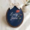 Custom Name Floral Hoop with Linen Bow: Hand-Embroidered Baby Name Sign