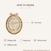 Oval embroidery hoop with bow and stitched goose in leaf wreath, sample Olivia design