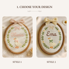 Two style options of oval embroidery hoop baby name sign with goose and leaf wreath