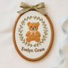 Hand-Embroidered Teddy Name Sign: Custom Oval Hoop for Nursery Decor